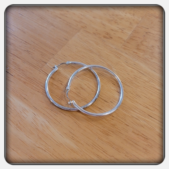 NWOT Woman's Silver-tone Hoop Earrings - Picture 3 of 3